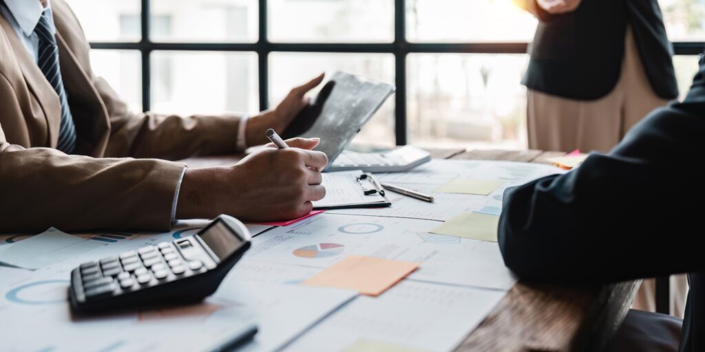 group of business people brainstorm discussing current finance and economy on company investment